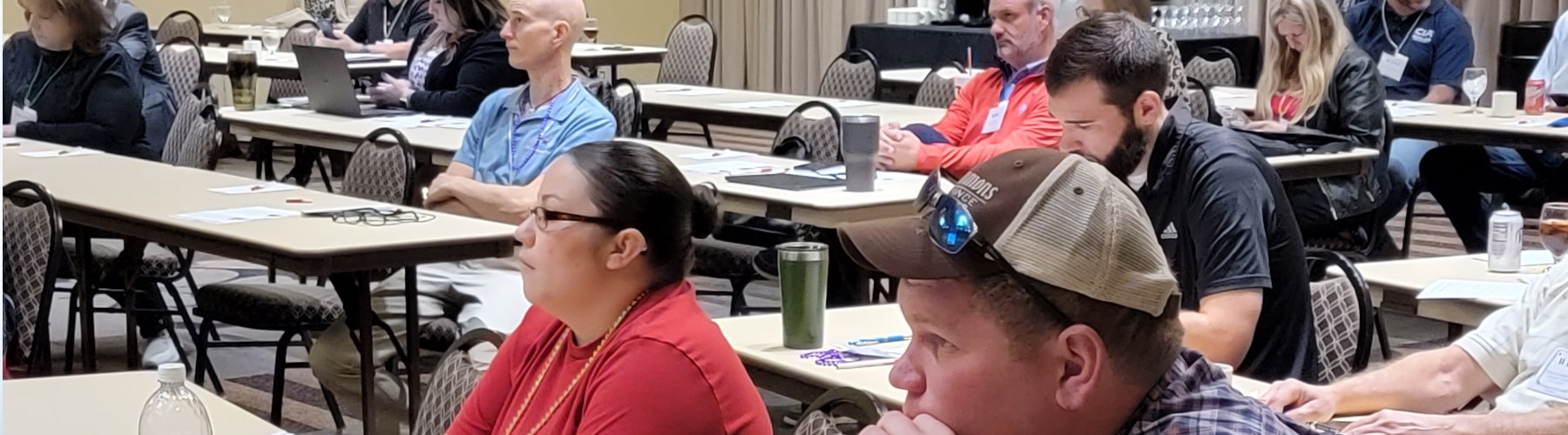 man giving presentation to a large room of people